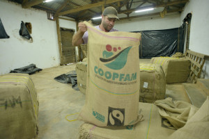 Audrei Cavalho Suarez is rearranging coffee bags.